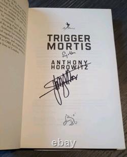 SIGNED By Stirling Moss & Anthony Horowitz Trigger Mortis 1st Edition Book Bond SIGNED By Stirling Moss & Anthony Horowitz Trigger Mortis 1st Edition Book Bond